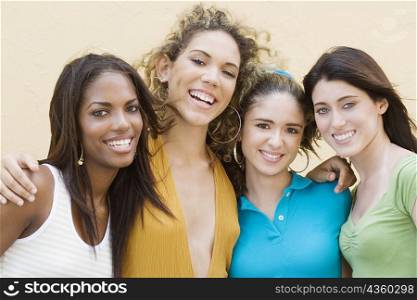 Portrait of four teenage girls smiling