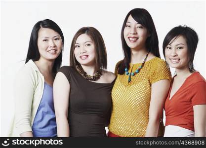 Portrait of four young women smiling