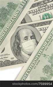 Portrait of Franklin on 100 dollar banknote with medical mask. The concept of coronavrius epidemic and the financial crisis caused by this collapse. Portrait of Franklin on 100 dollar banknote with medical mask