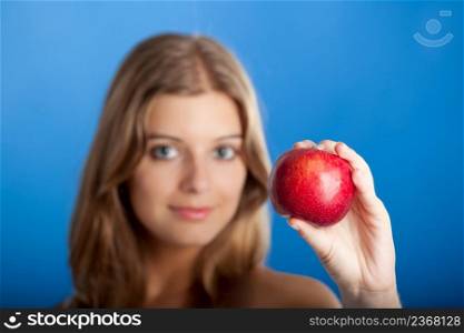 Portrait of Fresh and Beautiful young woman holding a red apple