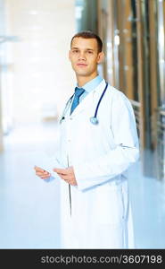 Portrait of friendly male doctor in hospital smiling