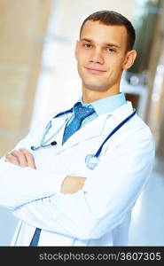 Portrait of friendly male doctor in hospital smiling