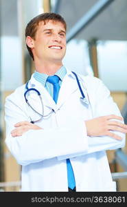 Portrait of friendly male doctor in hospital smiling