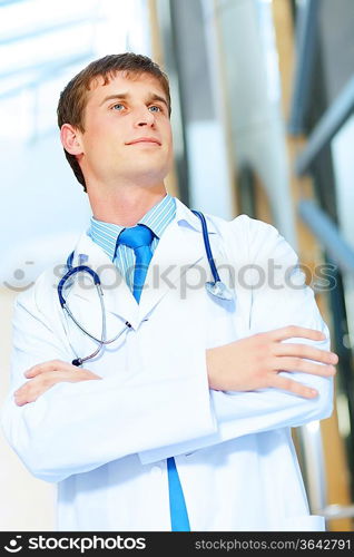 Portrait of friendly male doctor in hospital smiling