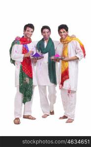Portrait of friends with holi colours