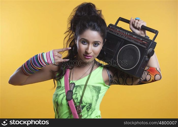 Portrait of funky woman with cassette player