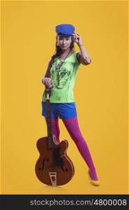 Portrait of funky woman with guitar