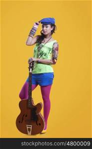 Portrait of funky woman with guitar