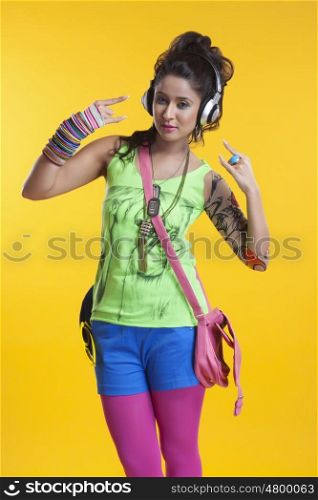 Portrait of funky young woman listening to music