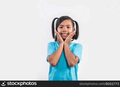 Portrait of Funny little girl acting in studio shot