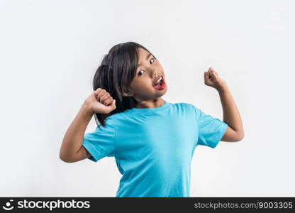 Portrait of Funny little girl acting in studio shot