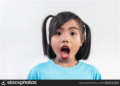 Portrait of Funny little girl acting in studio shot