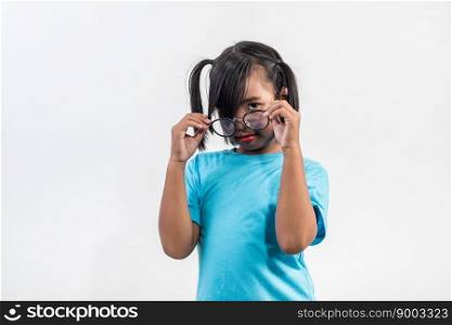 Portrait of Funny little girl acting in studio shot