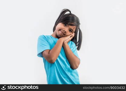 Portrait of Funny little girl acting in studio shot