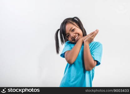 Portrait of Funny little girl acting in studio shot