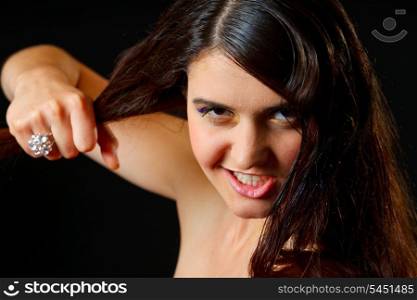 Portrait of furious young girl holding hair in hand&#xA;