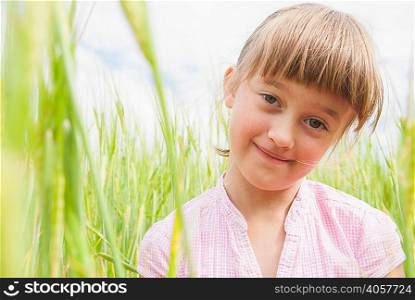 Portrait of girl in field, close up