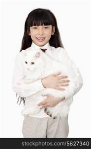 Portrait of girl in white holding a white cat