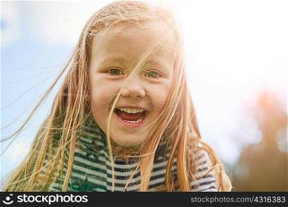 Portrait of girl looking at camera smiling