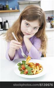 Portrait Of Girl Not Enjoying Healthy Meal At Home
