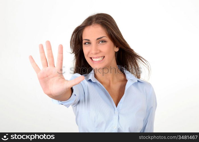 Portrait of girl showing hand to camera