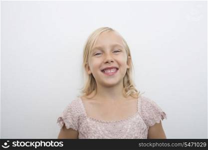 Portrait of girl smiling over white background