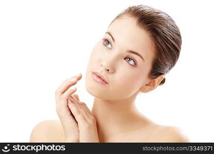 Portrait of girl touching the well-groomed face, isolated on a white background