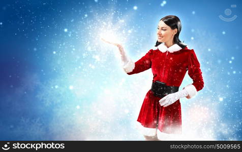 Portrait of girl wearing santa claus clothes. Portrait of beautiful girl wearing santa claus clothes on red background