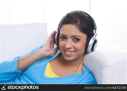 Portrait of girl with headphones listening to music
