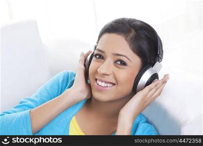 Portrait of girl with headphones listening to music