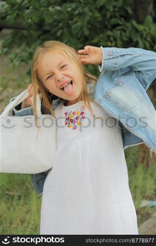 Portrait of girl with smile and makes faces