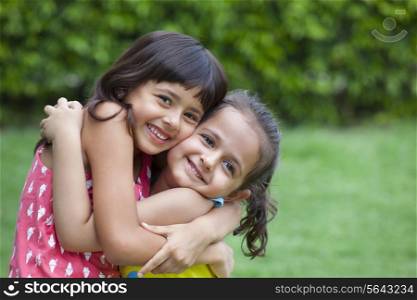 Portrait of girls hugging each other