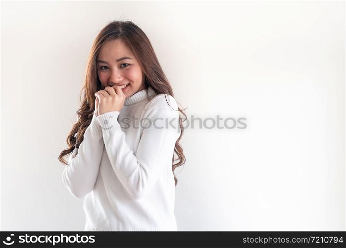 Portrait of good-looking beautiful young asian adult girl wearing white sweater for winter on white background