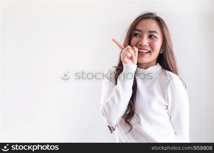 Portrait of good-looking beautiful young asian adult girl wearing white sweater for winter on white background
