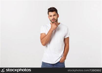 Portrait of good-looking male model expressing surprise and joy raising his hands, isolated over white background. Portrait of good-looking male model expressing surprise and joy raising his hands, isolated over white background.