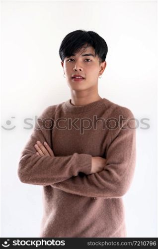 Portrait of good-looking smart Teenager young asian adult boy wearing brown sweater for winter on white background