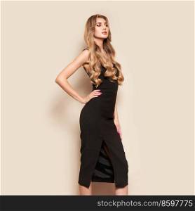 Portrait of gorgeous elegant sensual blonde woman wearing fashion black dress isolated on white background. Model woman with long curly hairstyle. Care and beauty hair product