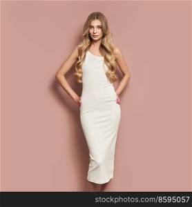 Portrait of gorgeous elegant sensual blonde woman wearing fashion white dress isolated on beige background. Model woman with long curly hairstyle. Care and beauty hair product