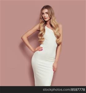 Portrait of gorgeous elegant sensual blonde woman wearing fashion white dress isolated on beige background. Model woman with long curly hairstyle. Care and beauty hair product