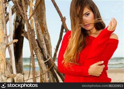 Portrait of gorgeous fashionable woman outdoor.. Beauty and fashion of women. Fashionable woman resting outdoor. Portrait of attractive gorgeous long haired lady in red.