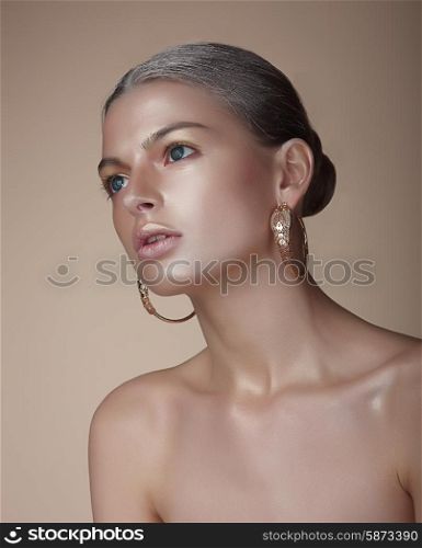 Portrait of Gorgeous Woman with Earrings