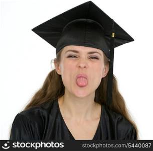 Portrait of graduation student girl showing tongue