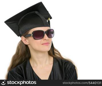 Portrait of graduation student woman in sunglasses looking on copy space