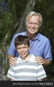 Portrait of grandfather with boy (10-12)