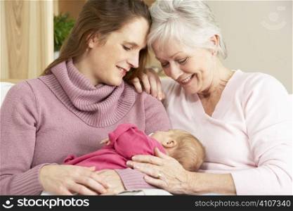 Portrait Of Grandmother, Mother And Daughter At Home