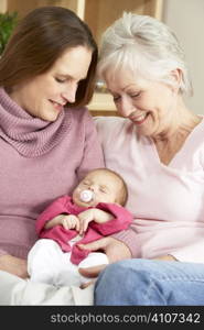 Portrait Of Grandmother, Mother And Daughter At Home