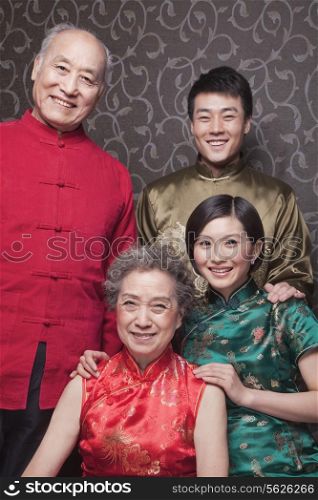 Portrait of grandparents and adult grandchildren in traditional Chinese clothing