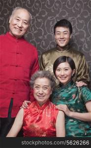 Portrait of grandparents and adult grandchildren in traditional Chinese clothing