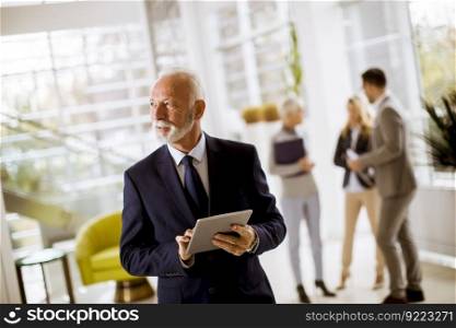 Portrait of group smiling business people standing in office