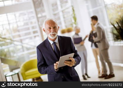 Portrait of group smiling business people standing in office